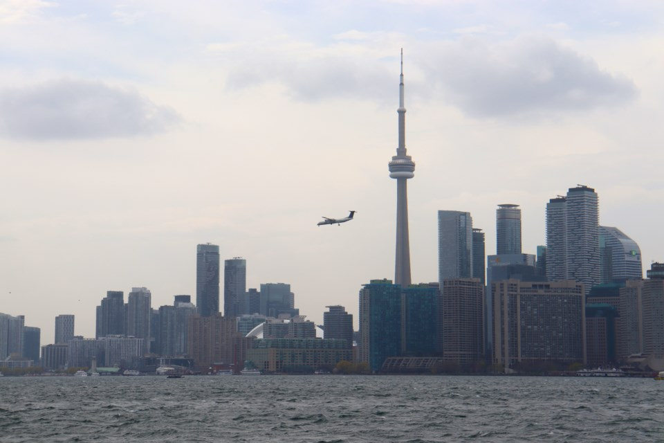 Plane crosses Toronto skyline and goes in for a landing at Billy Bishop AirportAlex Flood/TorontoToday